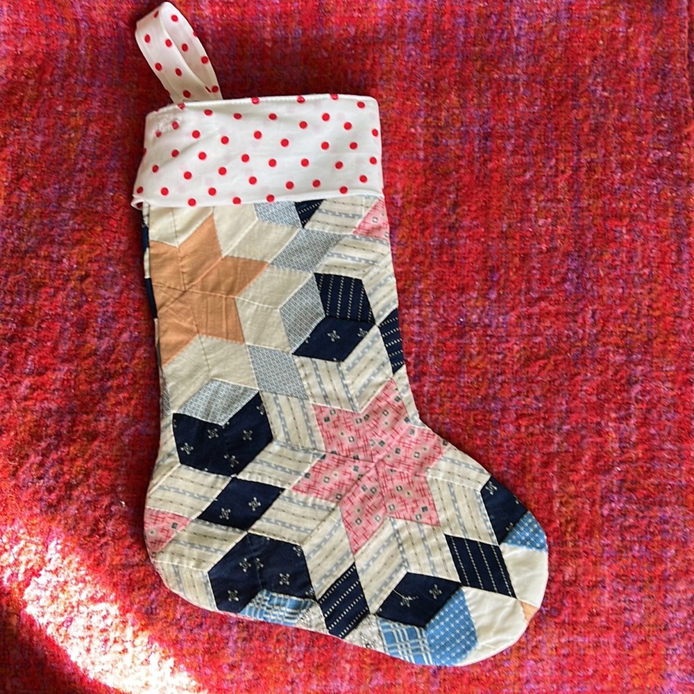 Quilted Christmas stocking. Handcrafted with love. It has a lovely vintage Look.